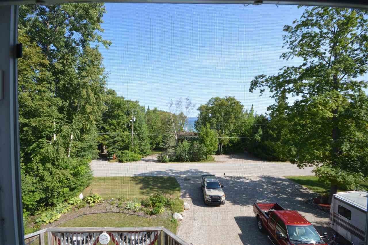 29. Single Family Homes for Sale at 7050 Nine Mile Point Drive Charlevoix, Michigan 49720 United States