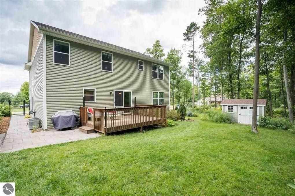 17. Single Family Homes for Sale at 3176 Winchester Drive Traverse City, Michigan 49686 United States