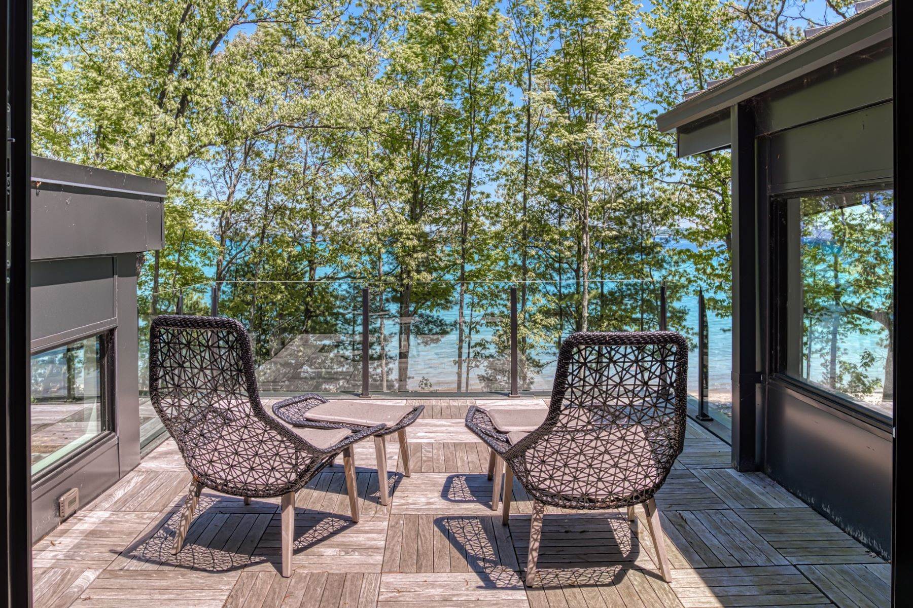 37. Single Family Homes for Sale at Custom Designed Modern Home 3693 S. Bay Ridge Drive Suttons Bay, Michigan 49682 United States