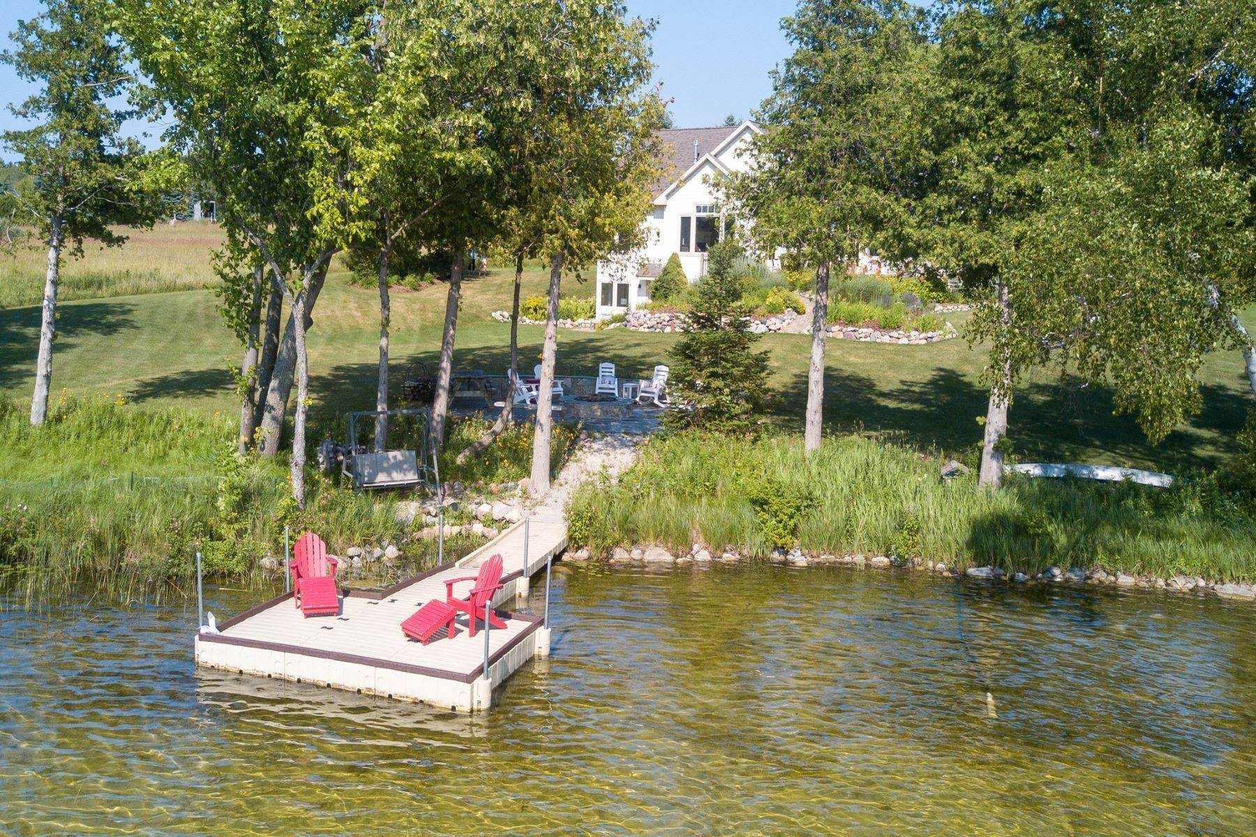 21. Single Family Homes for Sale at Susan Lake Cottage 07805 Eagle Nest Circle Charlevoix, Michigan 49720 United States
